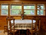 Dining Table with Windows Overlooking Back Deck and Yard